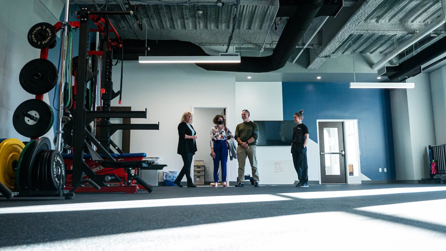 People stand inside a fitness space in Shenandoah University's new Wilkins Health & Fitness Suite.