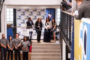 Representatives from Shenandoah University and the U.S. Department of the Treasury cut a ribbon inside the Hub for Innovators, Veterans and Entrepreneurs.