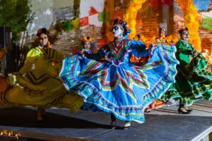 Three dancers from Oaxaca perform at Día de los Muertos