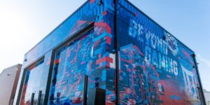 Exterior photo of the Shenandoah University Esports Arena. Shows imaging that says "Beyond Gaming."