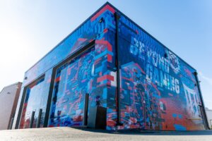 Exterior photo of the Shenandoah University Esports Arena. Shows imaging that says "Beyond Gaming."