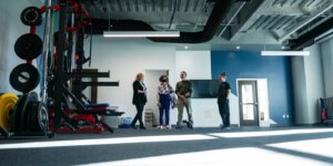 People stand inside a fitness space in Shenandoah University's new Wilkins Health & Fitness Suite.