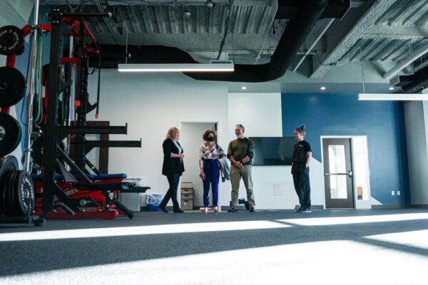 People stand inside a fitness space in Shenandoah University's new Wilkins Health & Fitness Suite.