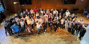 Sweet Honey in the Rock® group photo with university and local high school choirs