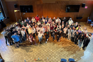 Sweet Honey in the Rock® group photo with university and local high school choirs