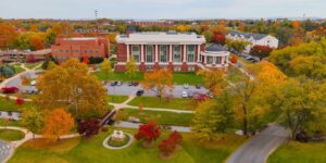 Fall drone image of Shenandoah University's main campus, with the Pruitt Health & Life Sciences Building prominently featured