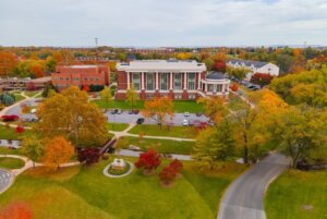 Fall drone image of Shenandoah University's main campus, with the Pruitt Health & Life Sciences Building prominently featured