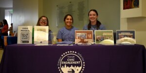 Students staffing a Shenandoah University Center for Civic Engagement table at the Brandt Student Center